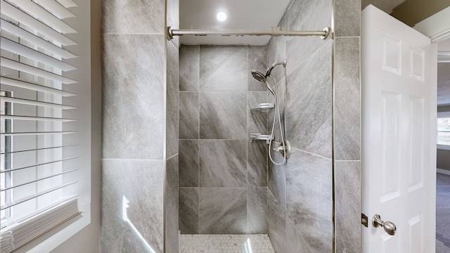 bathroom with a tile shower