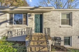 entrance to property with a patio