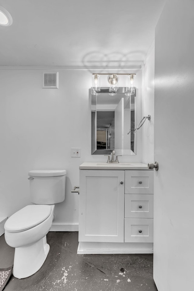 bathroom featuring vanity and toilet