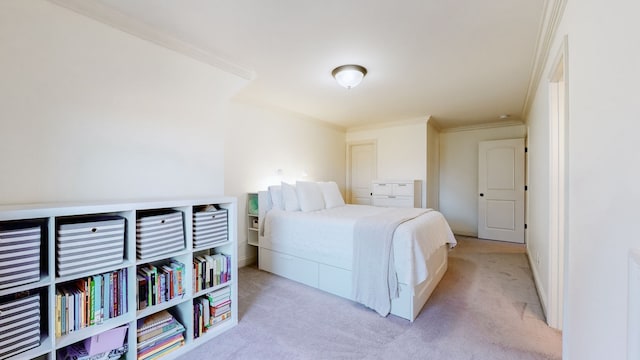 carpeted bedroom featuring ornamental molding