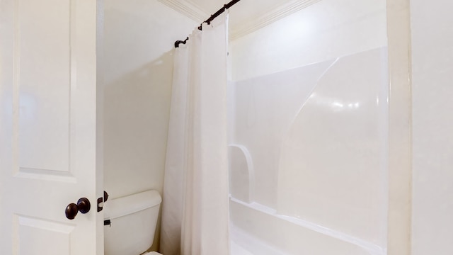 bathroom featuring toilet and crown molding