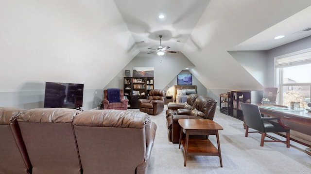 living room featuring ceiling fan, light colored carpet, and lofted ceiling