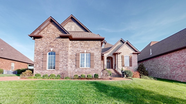 view of front of home with a front lawn