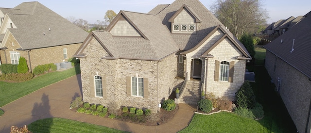 view of side of home featuring a yard