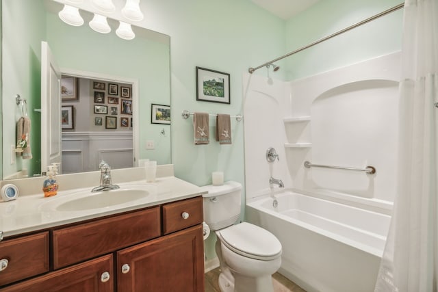 full bathroom featuring shower / bathing tub combination, vanity, and toilet