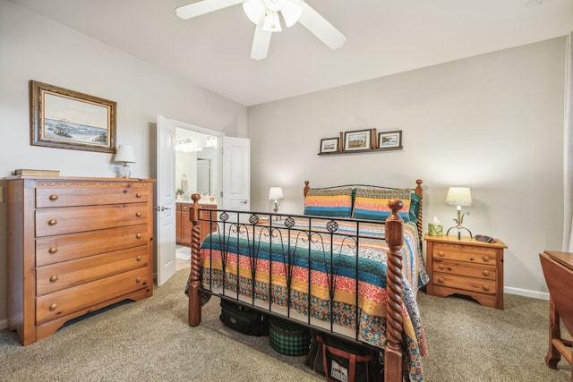 bedroom with carpet flooring, ceiling fan, and ensuite bathroom