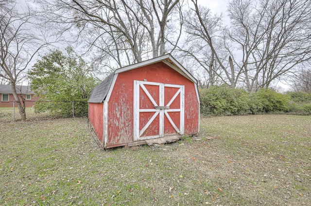 view of outdoor structure with a lawn