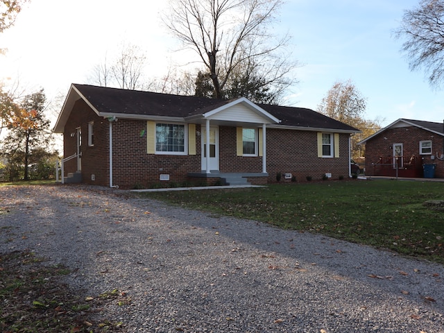 ranch-style house with a front lawn