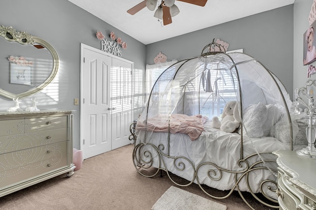 bedroom with light colored carpet, multiple windows, and ceiling fan