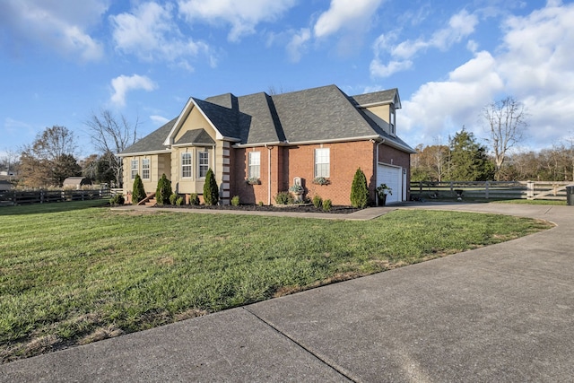 view of front of property with a front yard and a garage