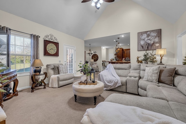 living room with carpet flooring, ceiling fan with notable chandelier, and high vaulted ceiling