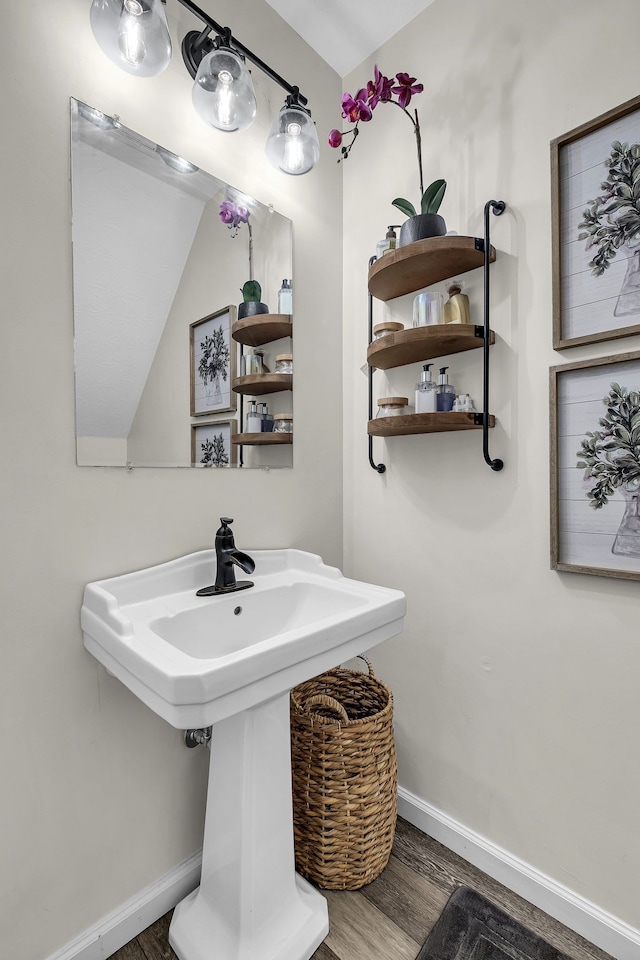 bathroom with hardwood / wood-style floors and sink