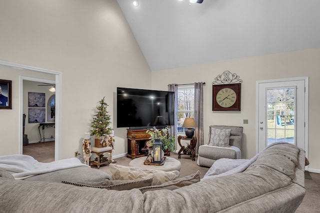 living room featuring ceiling fan, light carpet, and high vaulted ceiling