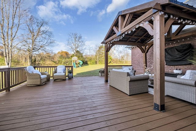 wooden terrace featuring a playground and an outdoor hangout area