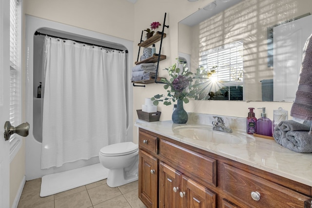 full bathroom featuring tile patterned flooring, shower / bath combo, vanity, and toilet