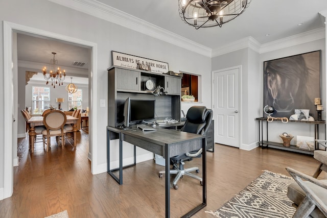 office with hardwood / wood-style flooring, crown molding, and a notable chandelier