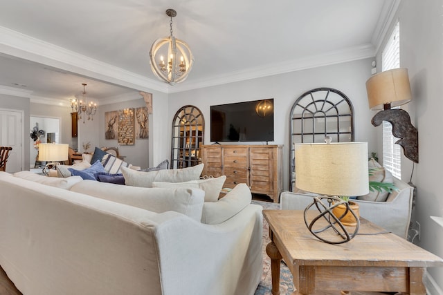 living room with crown molding and a chandelier