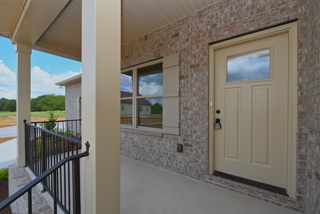 entrance to property featuring a porch