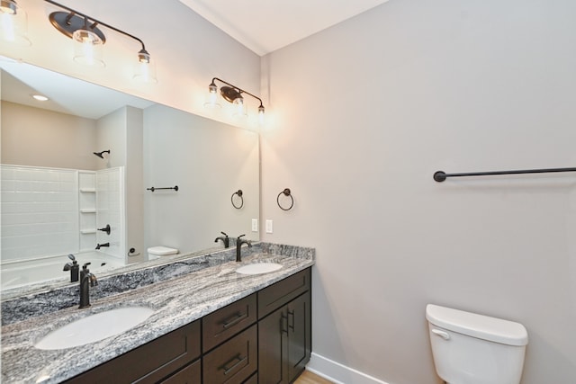 full bathroom featuring vanity, toilet, and shower / bath combination