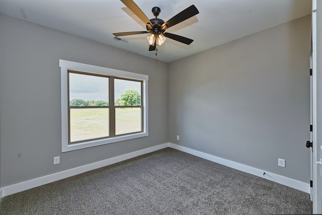 carpeted empty room featuring ceiling fan