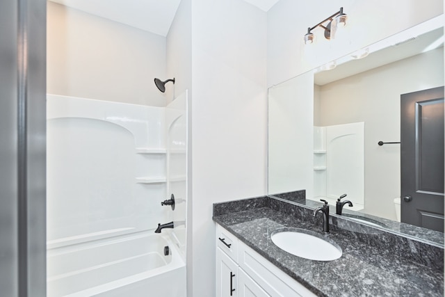 bathroom featuring vanity and tub / shower combination