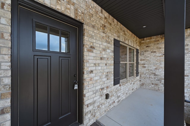 doorway to property featuring covered porch