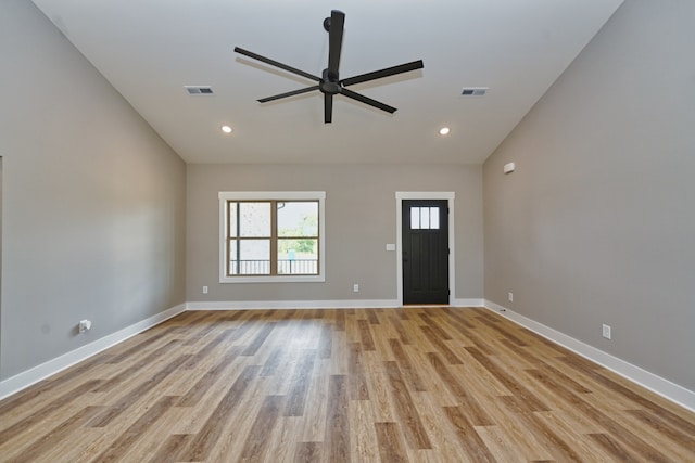 foyer featuring light hardwood / wood-style flooring, ceiling fan, and lofted ceiling