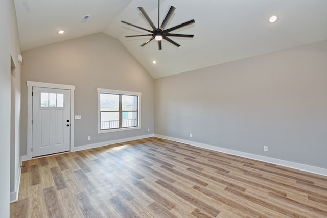 entrance foyer with high vaulted ceiling, light hardwood / wood-style flooring, and ceiling fan