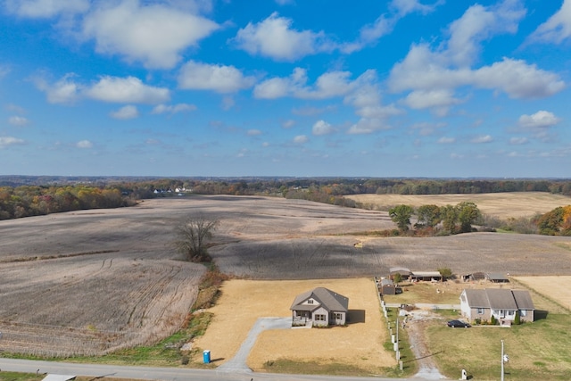 birds eye view of property with a rural view