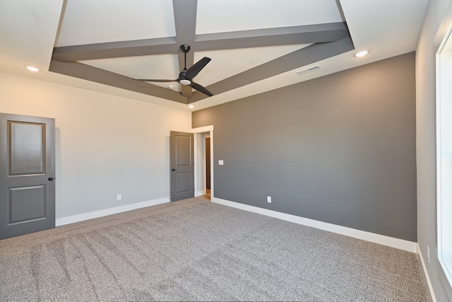 carpeted spare room featuring ceiling fan