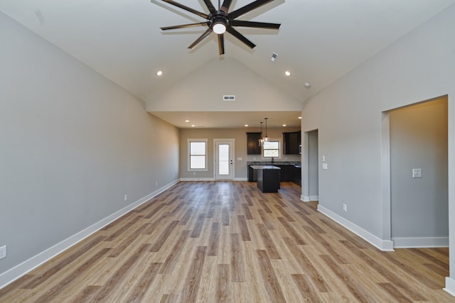 unfurnished living room featuring ceiling fan, high vaulted ceiling, and light hardwood / wood-style flooring