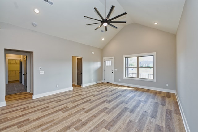 unfurnished living room with ceiling fan, light hardwood / wood-style flooring, and high vaulted ceiling