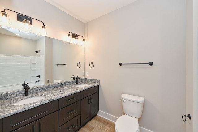 bathroom featuring vanity, toilet, and wood-type flooring