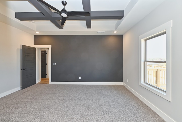 carpeted empty room with beam ceiling, ceiling fan, and coffered ceiling