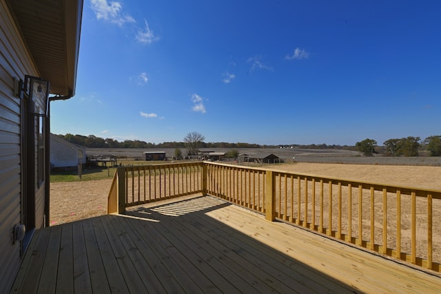 wooden terrace with a rural view