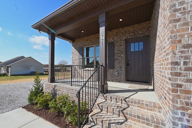 doorway to property featuring covered porch