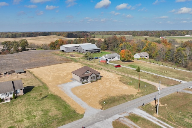 birds eye view of property with a rural view