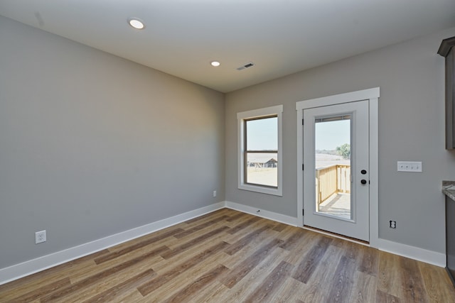 unfurnished room featuring light hardwood / wood-style flooring