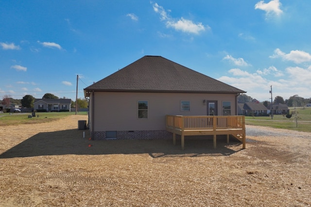 back of house with a wooden deck