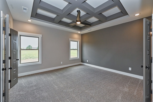 carpeted spare room featuring ceiling fan, beam ceiling, and coffered ceiling