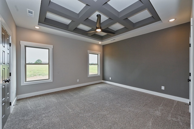 empty room featuring beamed ceiling, carpet floors, and coffered ceiling