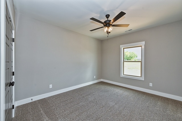 carpeted empty room with ceiling fan