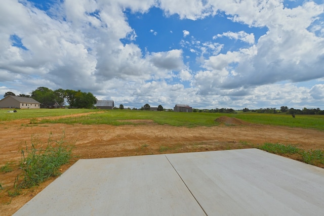 view of patio with a rural view