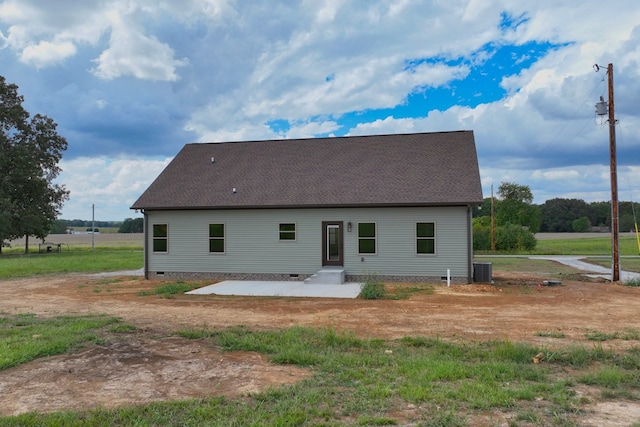 back of property featuring a patio and central AC