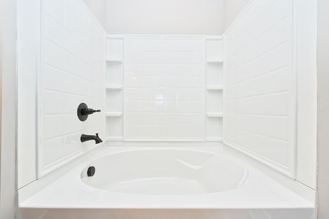 bathroom with bathing tub / shower combination