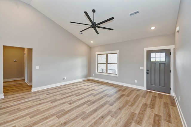 foyer with ceiling fan, light hardwood / wood-style floors, and high vaulted ceiling