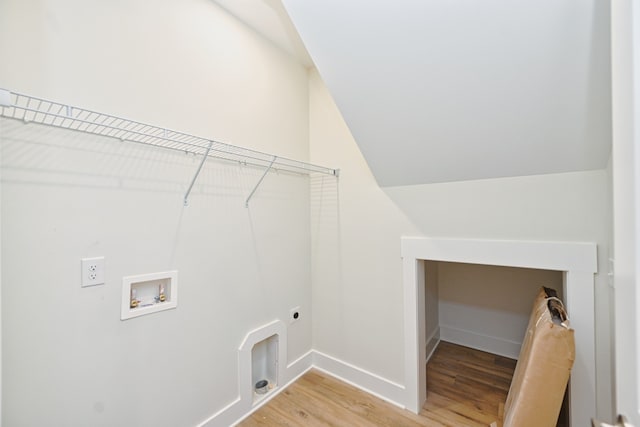 laundry area with electric dryer hookup, hookup for a washing machine, and hardwood / wood-style flooring