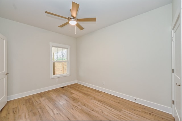 empty room with ceiling fan and light wood-type flooring