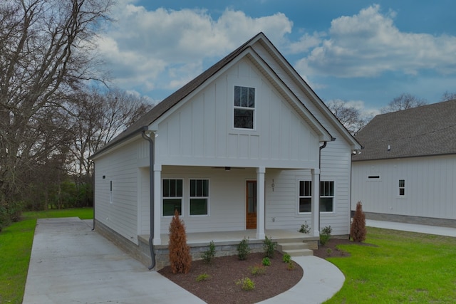 view of front of property with a front yard and a porch