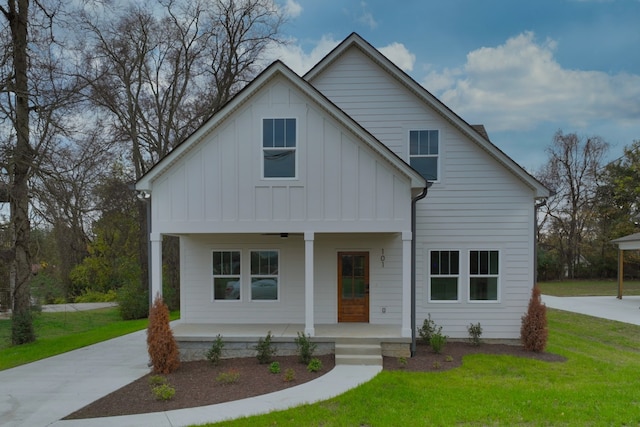 view of front of house with covered porch and a front yard